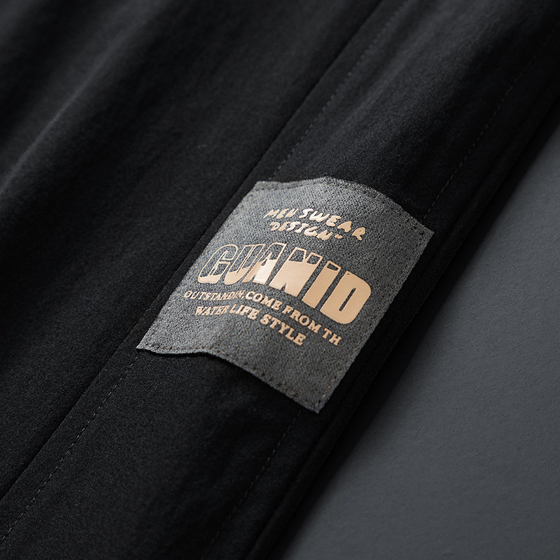 Pantalones deportivos para hombres pantalones casuales de tendencia sueltos de hielo de verano delgados nueve pantalones de patas pantalones para hombres al por mayor