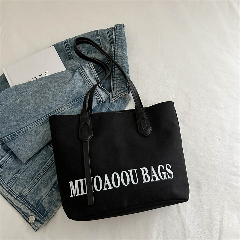 Bolsa de gran capacidad para mujeres 2024 otoño nuevo estilo de bolsa de lona universal bolso de hombro de viaje de estudiantes universitarios bolso de clase