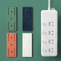 Plug in the fixed -fixed socket plug -in board fixed device to move the punch -free hanging wall paste sticker
