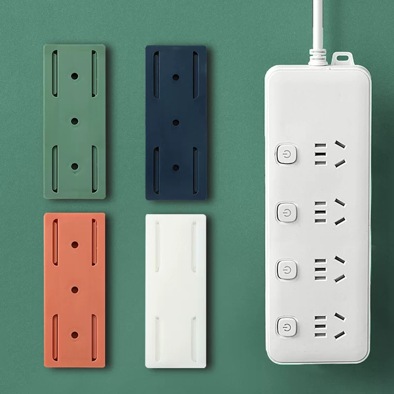 Plug in the fixed -fixed socket plug -in board fixed device to move the punch -free hanging wall paste sticker