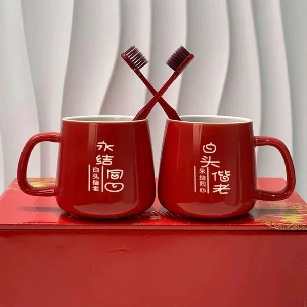 Red Bride Recommends: A pair of red ceramic wash cups for weddings, featuring red designs for the bride and groom