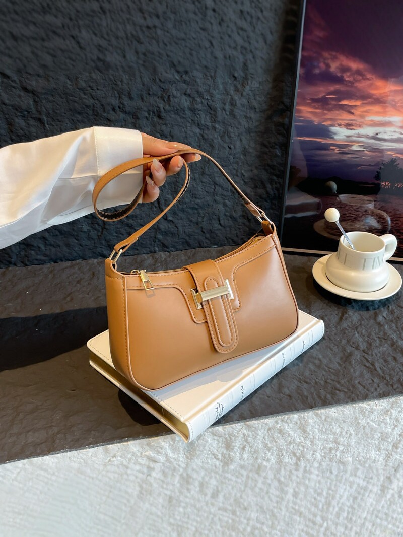 2025 nueva moda versátil bolso de brazo de mujer sensación de alto nivel bolso de hombro simple nicho de diseño de mano de viaje