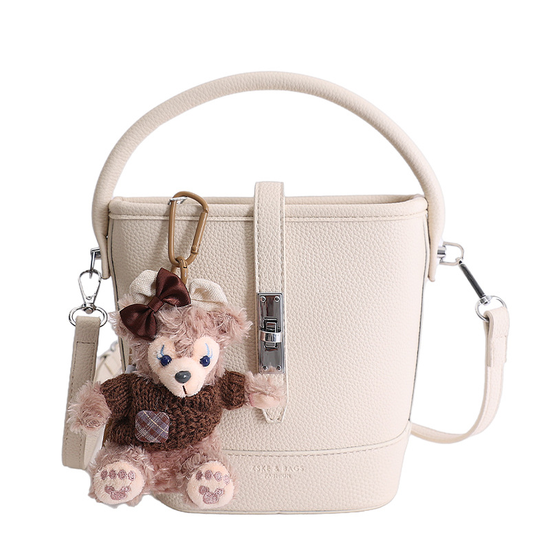 Litchi estampado bolso de cubo de mano mujer 2026 venta caliente nueva moda coreana alta textura mochila de hombro
