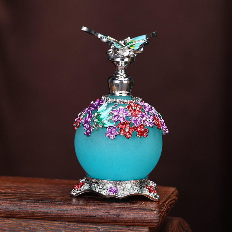 AliExpress Venta caliente mariposa 20ml botella de aceite de gran capacidad sub-embotellado botella de perfume de aleación de zinc botella de decoración al por mayor