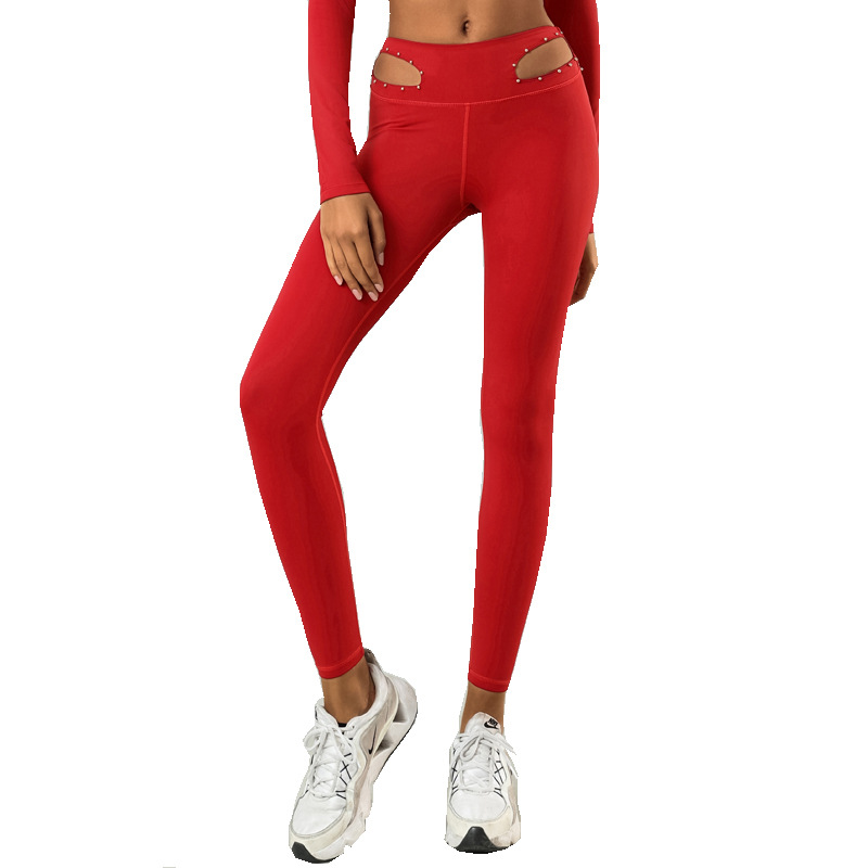 Pantalones de yoga transfronterizos de comercio exterior europeos y americanos pantalones de yoga de mujer huecos elásticos de secado rápido de cintura media-alta Reparación de piernas fitness deportes pantalones cortos