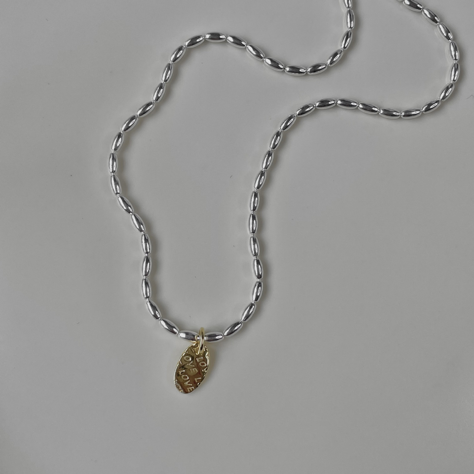 Japonés y coreano oro y plata amor collar arroz grano cuentas de oliva 925 plata esterlina nicho diseño clavícula cadena femenina joyería de plata de alto grado