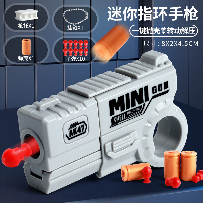 Mini dedo para niños, anillo de descompresión, pistola giratoria, puede lanzar proyectiles, juguetes geniales, juguetes novedosos para niños al por mayor