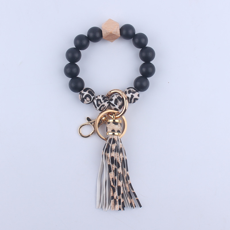 Nuevo cuero de LA PU corto Borla Llavero DIY de silicona de impresión de leopardo de color sólido con cuentas muñeca llavero colgante