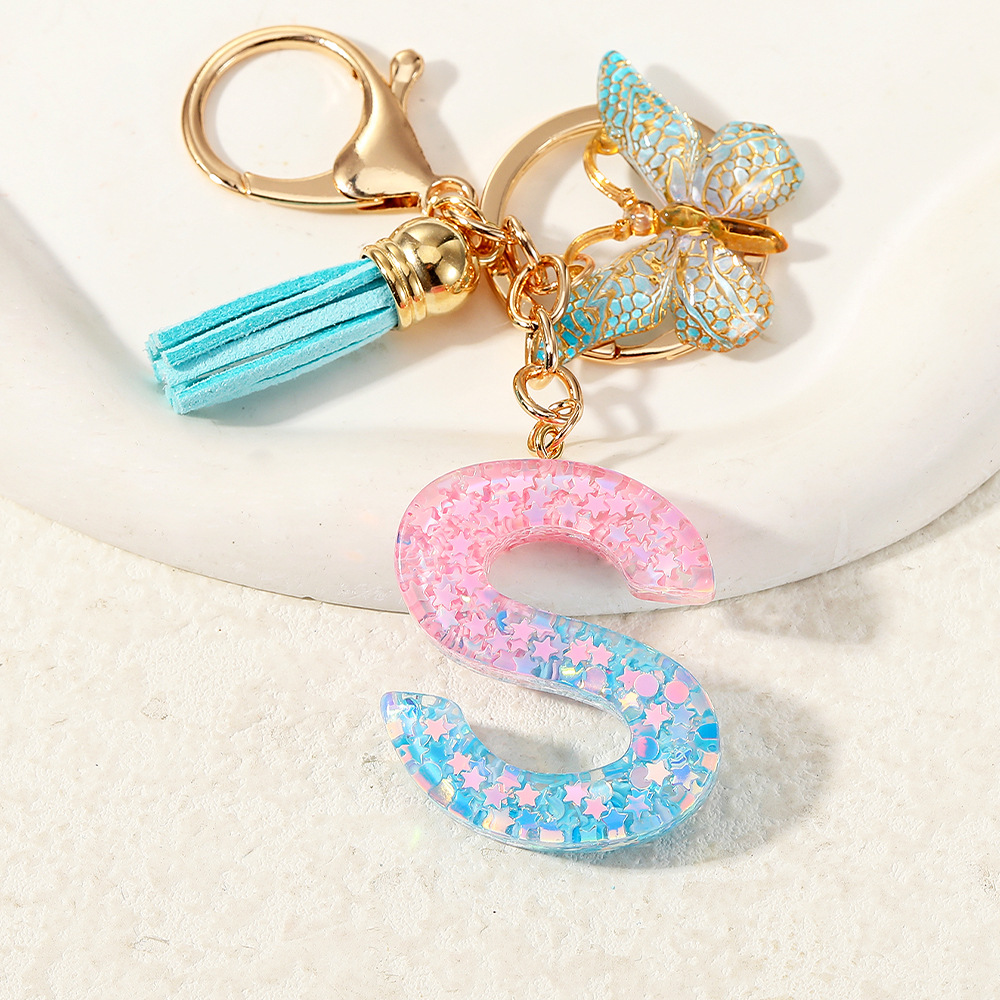 Europa y los Estados Unidos transfronterizos nuevos cristal sequinado goteo de goma letras inglesas joyería llavero y bolsos colgante apoyo al por mayor