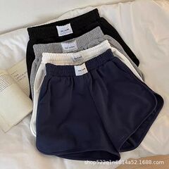 夏のシンプルなスポーツのショートカジュアルなズボンの婦人服の新型のワイドレギンスのショートパンツのデザインは合わせて腰の熱いズボンの卸売りを緩めます。