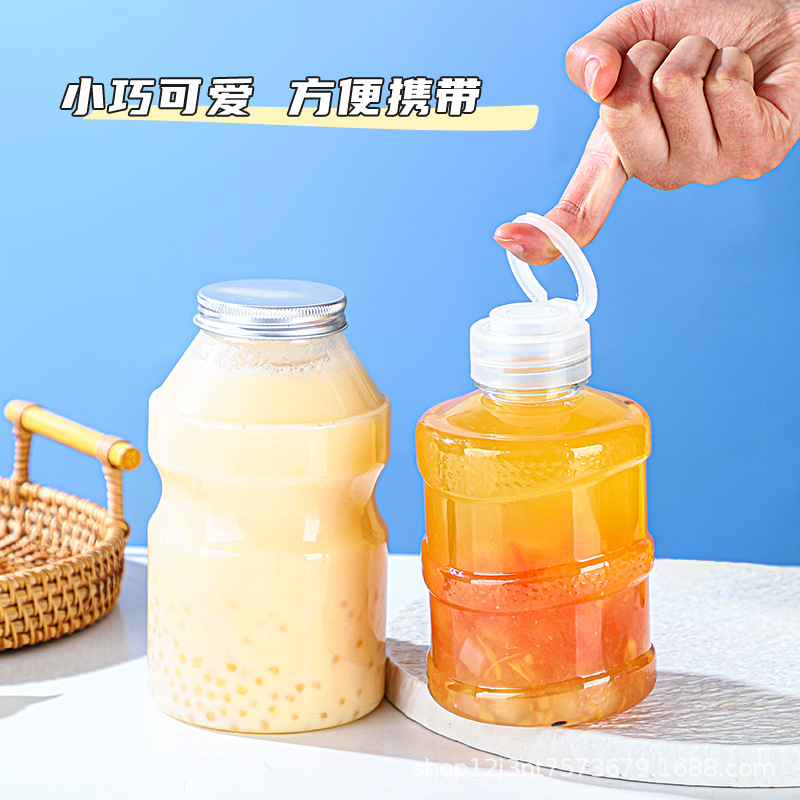 En stock cubo botella de plástico transparente PET jugo botella de bebidas grado alimenticio creativo desechable leche botella de té al por mayor