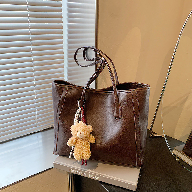 Bagos de textura de transporte aéreo 2024 otoño y invierno nuevo estilo coreano de moda bolso de hombro axilar temperamento bolso especial