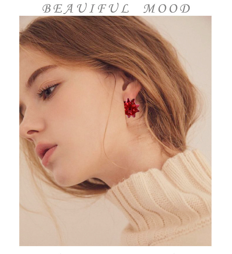 Europa y América nueva Navidad pendientes de metal simple Flor de Navidad regalo de las mujeres arco creativo pendientes en stock al por mayor
