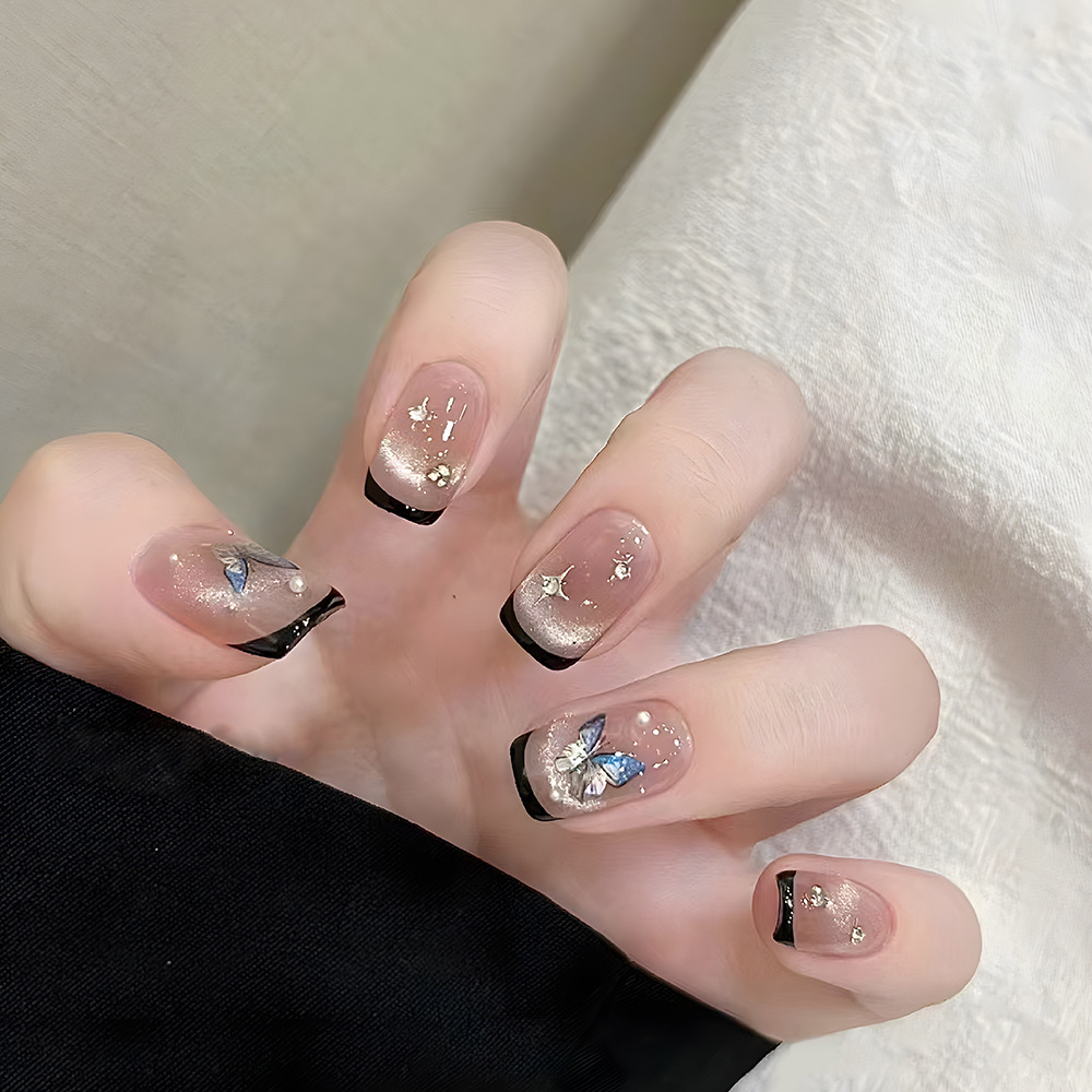 Pequeño libro rojo de venta caliente azul de hielo mariposa de manicuras bordes negros parches de uñas de diamantes franceses sonrientes ojos de gato usar uñas image 1