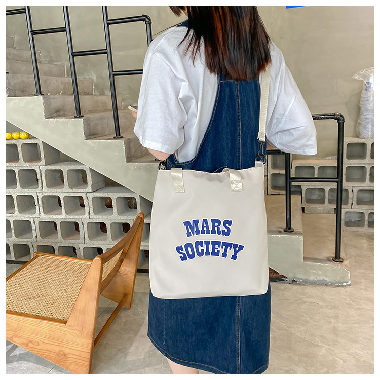 Canvas bag for women, single shoulder, ins crossbody, laid-back style, college student class bag, artistic Japanese style, large capacity, Hong Kong style, chic undefined