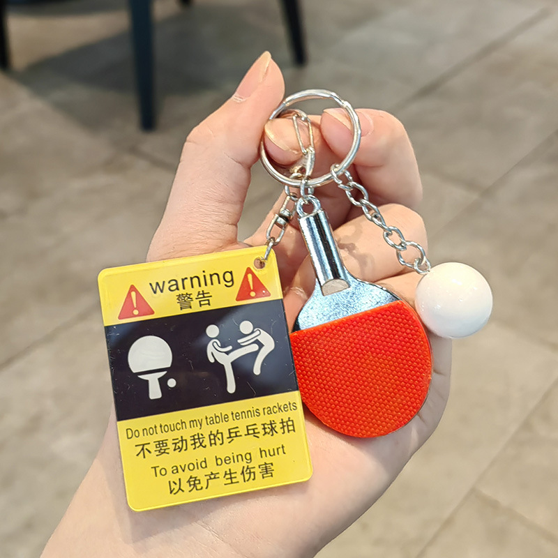 Kicking ping pong warning sign + big ping pong ball