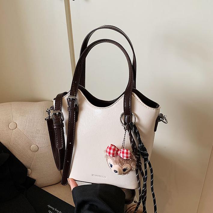 Bolsa de mano retro de color universal para mujeres 2025 nuevo nicho de diseño de tendencia bolso de hombro de alta calidad bolso de cubo