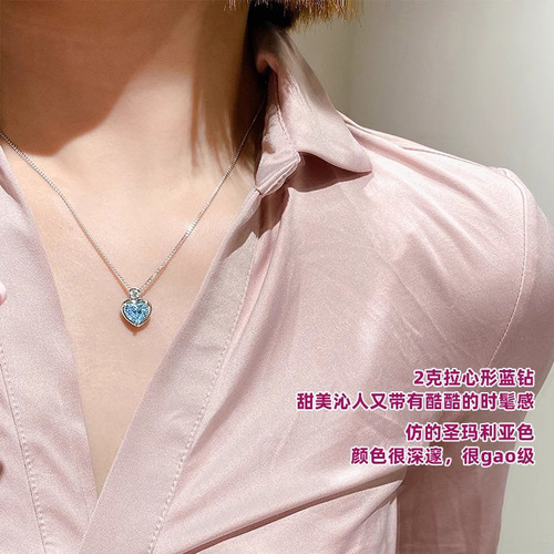 Heart-shaped pendant necklace for women with 2-carat blue diamond and aquamarine artificial diamonds, exuding a unique and sophisticated charm.
