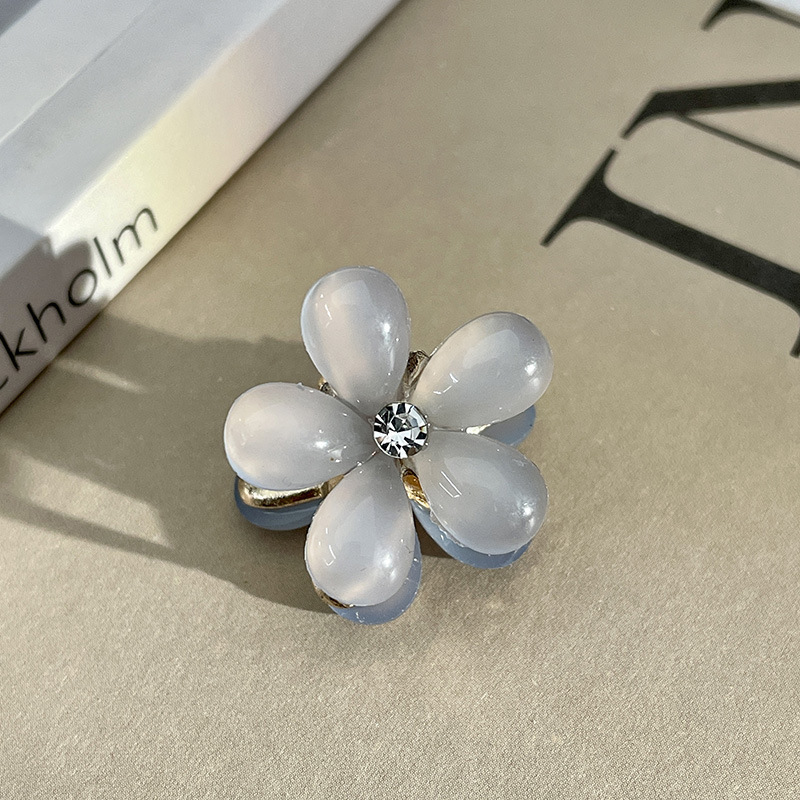 Pequeña flor de resina degradada-azul