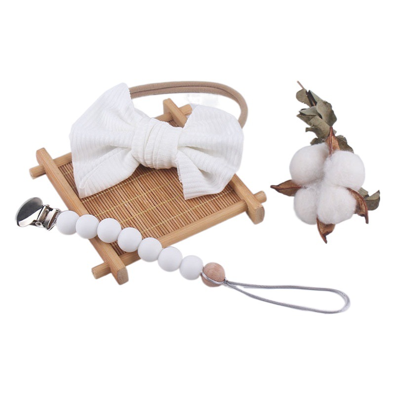 Accesorios para el cabello del bebé de Europa y América del arco de nylon banda para el cabello bebé suministros bebé chupete de silicona pezón anti-caída traje de cadena