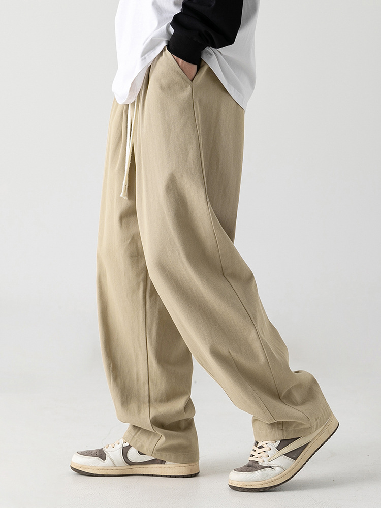 Pantalones casuales sueltos lavados en arena retro japoneses, estilo de primavera para hombres, marca de moda, diseño plisado tridimensional de todo fósforo más pantalones de terciopelo