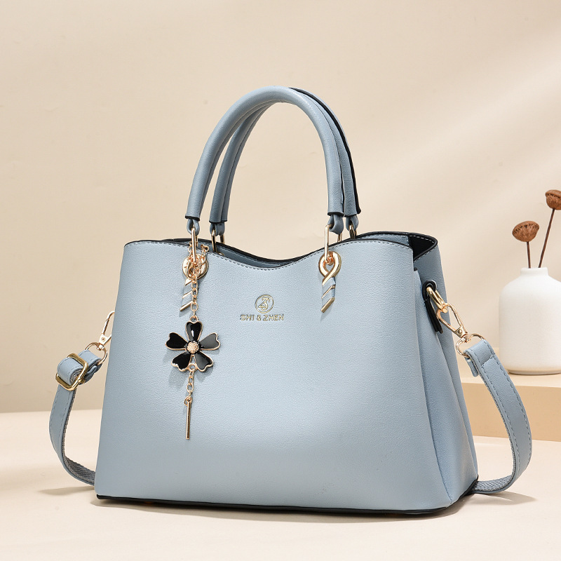 Colgante de flores bolsas de mano de color sólido de gran capacidad de moda versátil bolsas de hombro ocio de viaje oblicuo bolsas transfronterizas