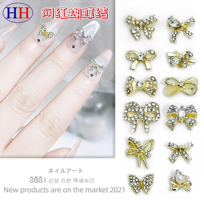Transfronterizo Japonés arco de uñas accesorios de pajarita caliente simple todo fósforo tridimensional hueco joyería de uñas de diamantes al por mayor