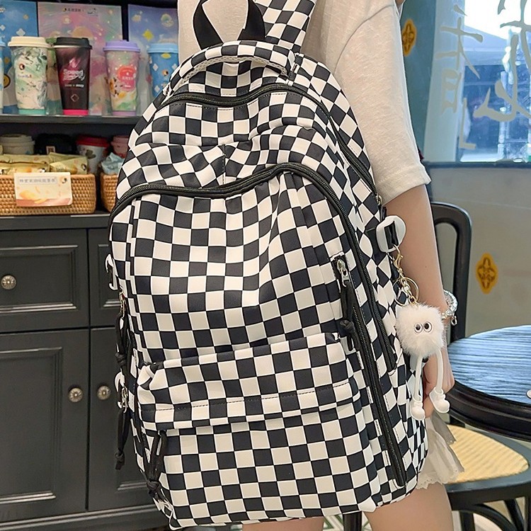 新款简约超轻黑白棋盘格帆布包女大容量双肩背包中小学生书包批发