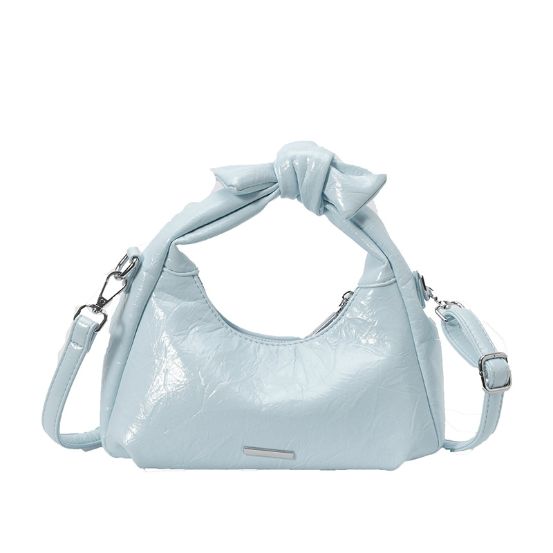 Bolsa de mano de arco para mujeres 2026 nuevo bolso de hombro de moda de verano super caliente sensación diaria mochila de viaje