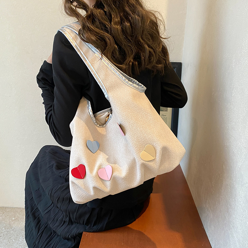 Bolsas de lienzo de nicho coreano para mujeres verano 2024 nueva moda bolsas de bolsa casuales, bolsas de brazo de la niña dulce