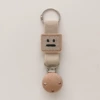Apricot (wooden hat clip with holes) khaki square smiley face