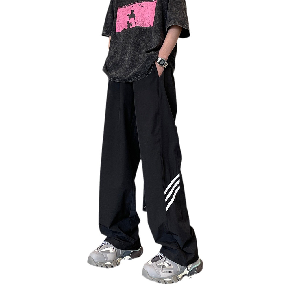 Pantalones de pierna ancha de secado rápido de calle alta estadounidense hombres y mujeres otoño nuevo casual suelto todo partido hip hop Rush pantalones moda masculina