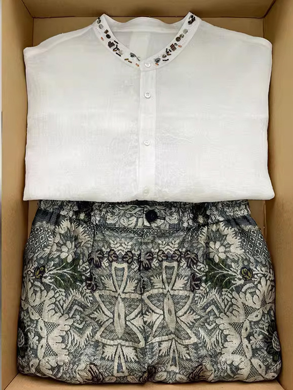 夏服は、女性用のフレンチハイエンドのプロフェッショナルリネンシャツトップとワイドレッグパンツのツーピーススーツの完全なセットと組み合わせられています。|undefined
