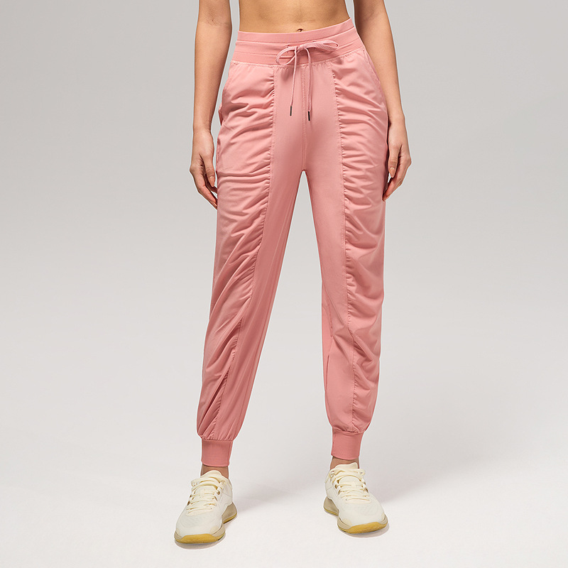 Pantalones deportivos casuales sueltos de mujer plegados para correr pantalones de yoga de nueve puntos de bolsillo secado rápido pantalones de pies transpirables