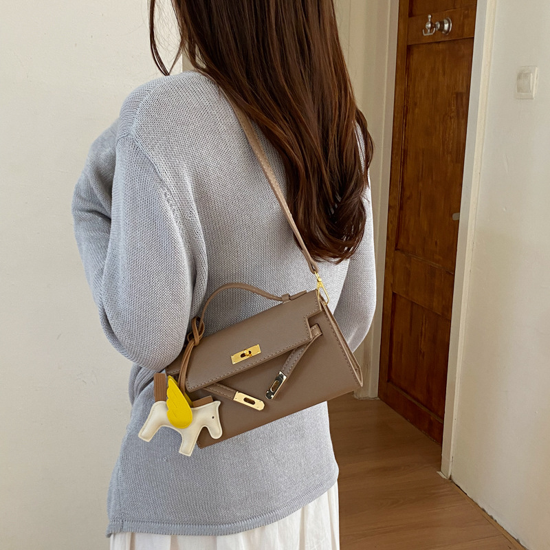 Texturas bolsos Kelly mujeres 2026 verano nuevo estilo de moda simple mochila diaria bolso de mano super caliente bolso pequeño image 3