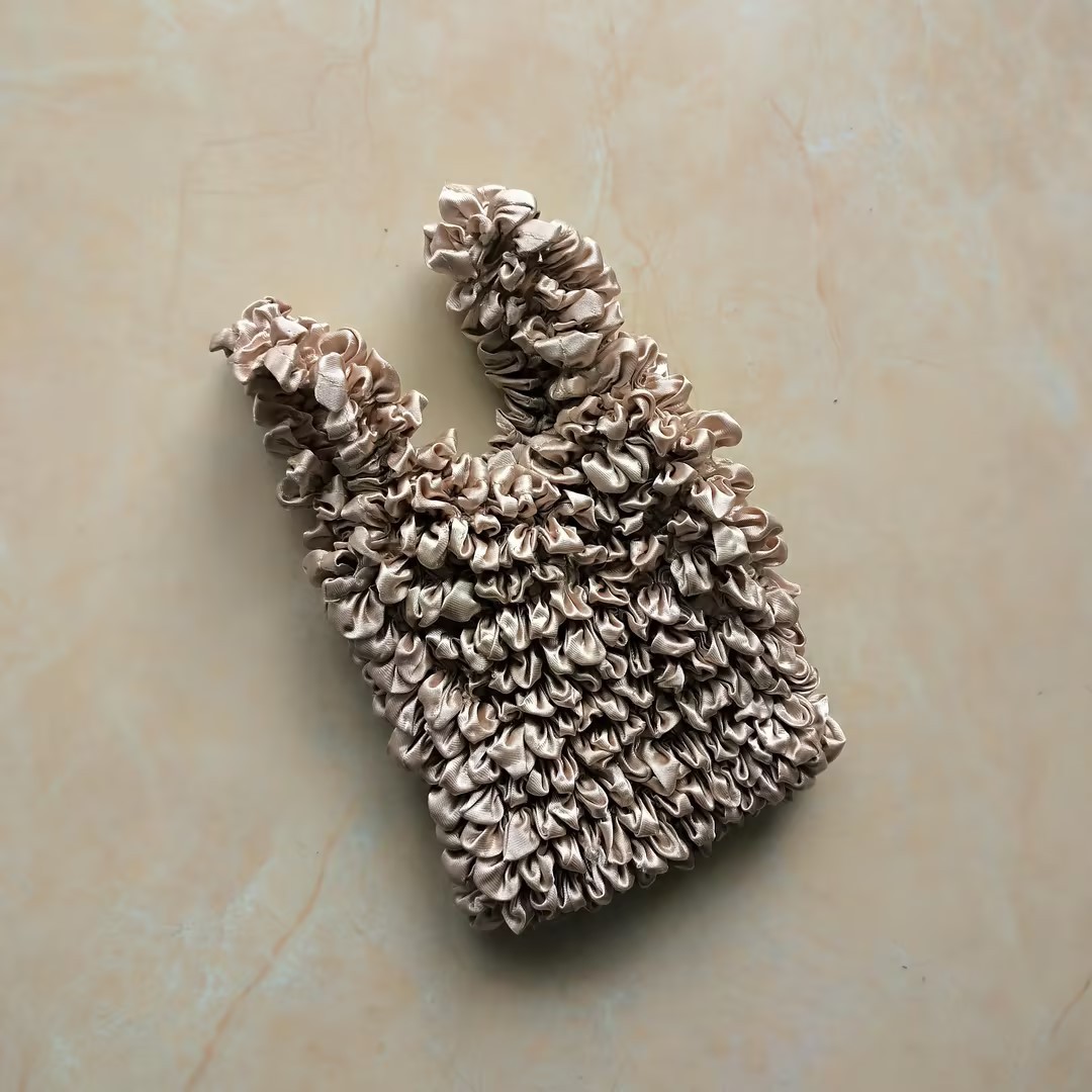 Bolso de burbuja multiusos popular de gran capacidad de la celebridad de Internet de las mujeres Bolso de burbuja japonés y coreano nuevo bolso mágico bolso telescópico bolso plisado