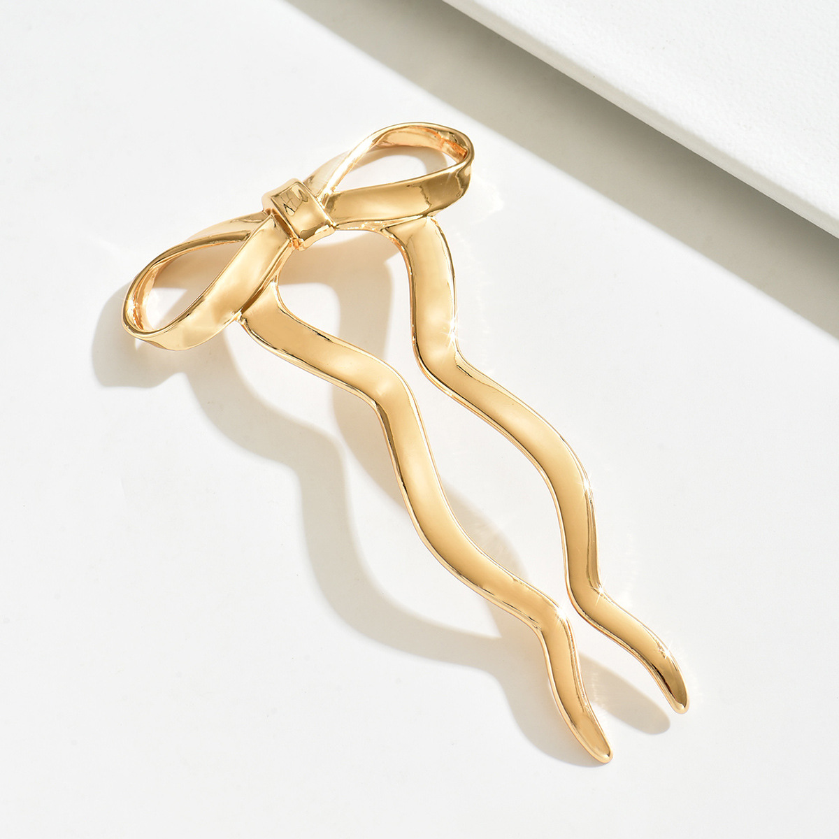 Comercio exterior nuevo clip de cabello de arco mujeres estilo minimalista estilo de alta sensibilidad joyería de cabello 2024 nuevo cabello enrolado joyería