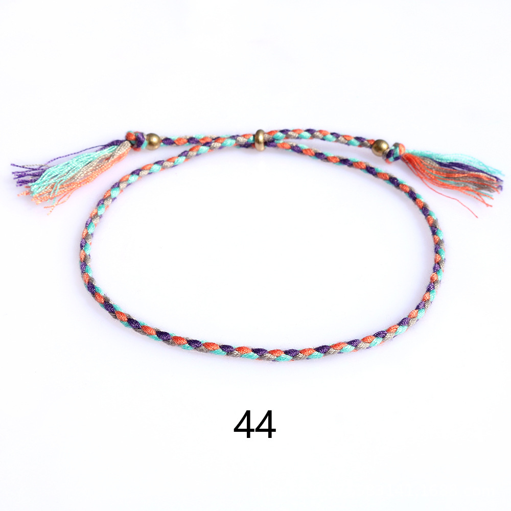 Amazon popular colorido cuerda de algodón amistad pulsera perlas de cobre borla pulsera tejida a mano ajustable hombres y mujeres pulsera