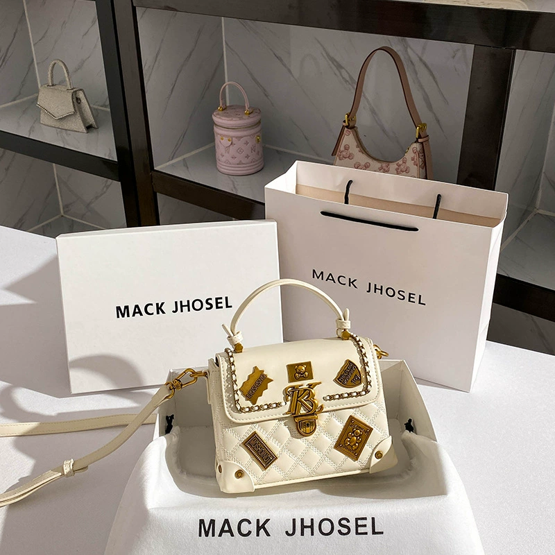Handheld bag with diamond pattern, small badge, box, 2023, Chanel style