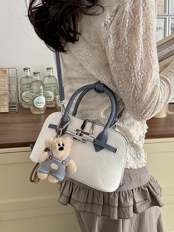 Bolsa de concha de nicho coreano para mujeres 2026 comercio exterior nuevo estilo de alta moda versátil mochila de hombro
