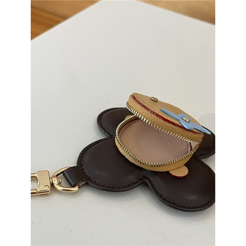 2025 nuevo solar flor de llaves bolsas de monedas bolsas de nicho de cuero bolsas colgantes bolsas de polvo de auriculares