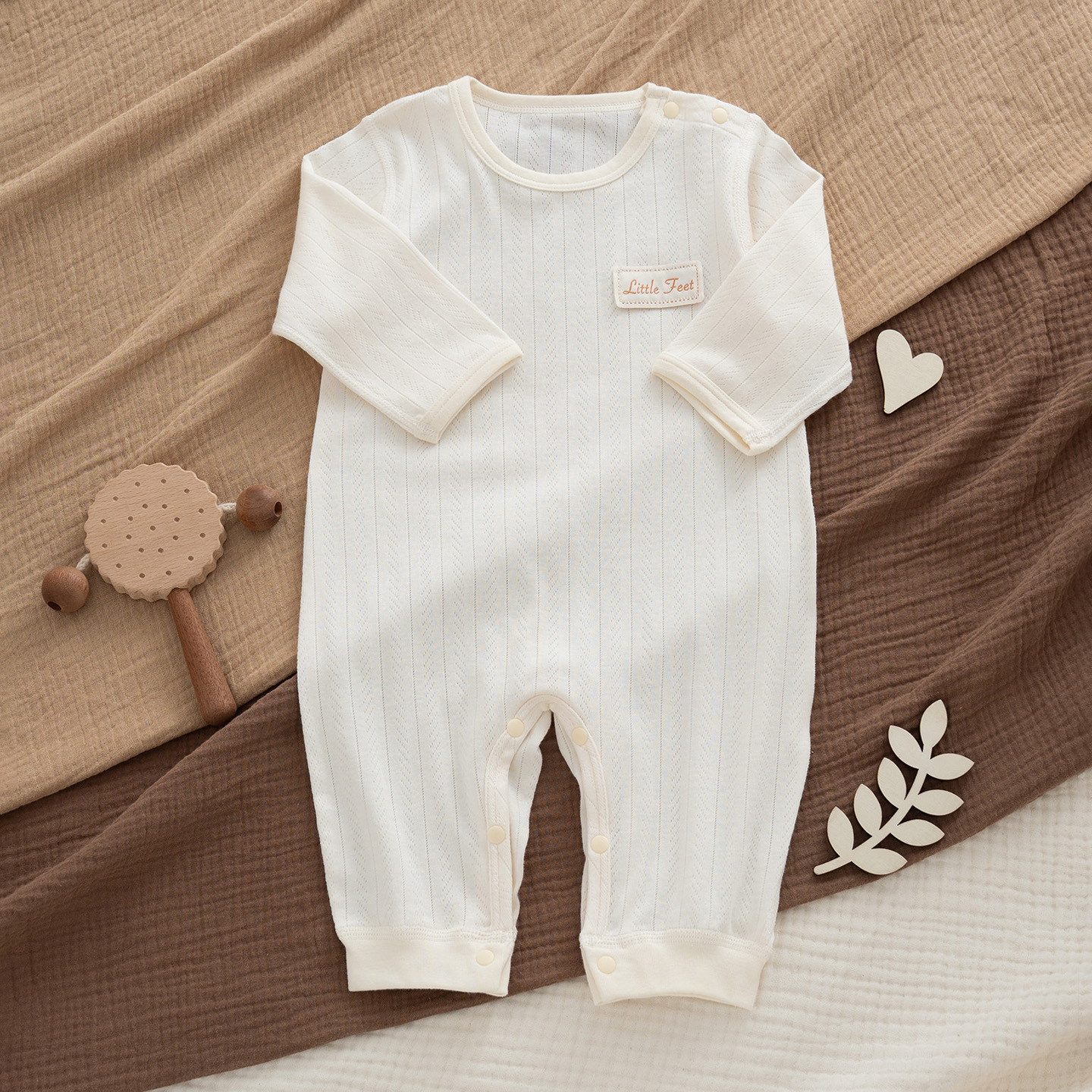One off-white cotton bodysuit