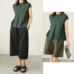 現物の綿麻のノースリーブのシャツは肩に落ちてやせている夏の婦人服が現れます。