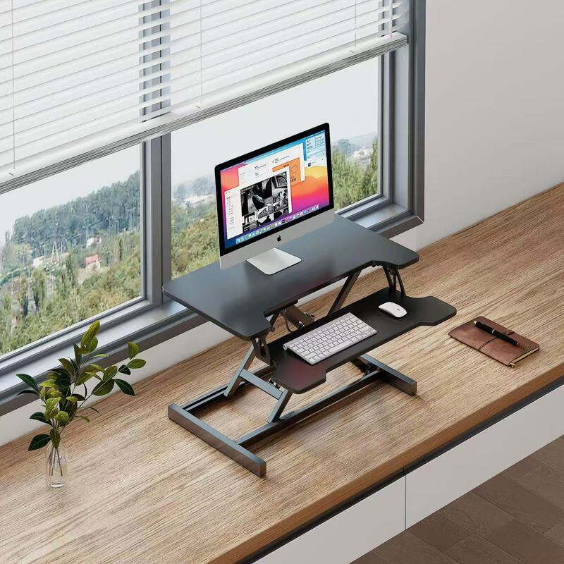 立っているデスクの昇降コンピュータの机の折り畳みの机の上で気動のタイプのデスクトップはノートの小さいテーブルを高く上げます。|undefined