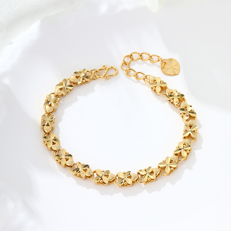 Xuping Europa y los Estados Unidos transfronterizos cuatro hojas de flores amor pulsera de oro de aleación de cobre ligera joyas de lujo al por mayor personalizadas image 5