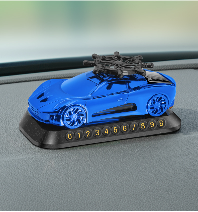 New solar helmsman car model aromatherapy ornaments car perfume three-in-one multifunctional car parking card car