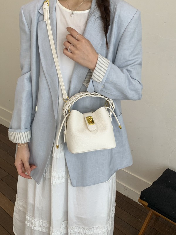 Bolsos de balde portátiles de alta calidad para mujeres 2026 verano nuevo lichi estampado viaje diario ocio versátil mochila