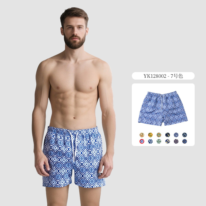 Pantalones de cuatro puntos florales de piel de melocotón para hombre, bañador casual de playa de tamaño europeo, forro de secado rápido, pantalones de playa de vacaciones junto al mar