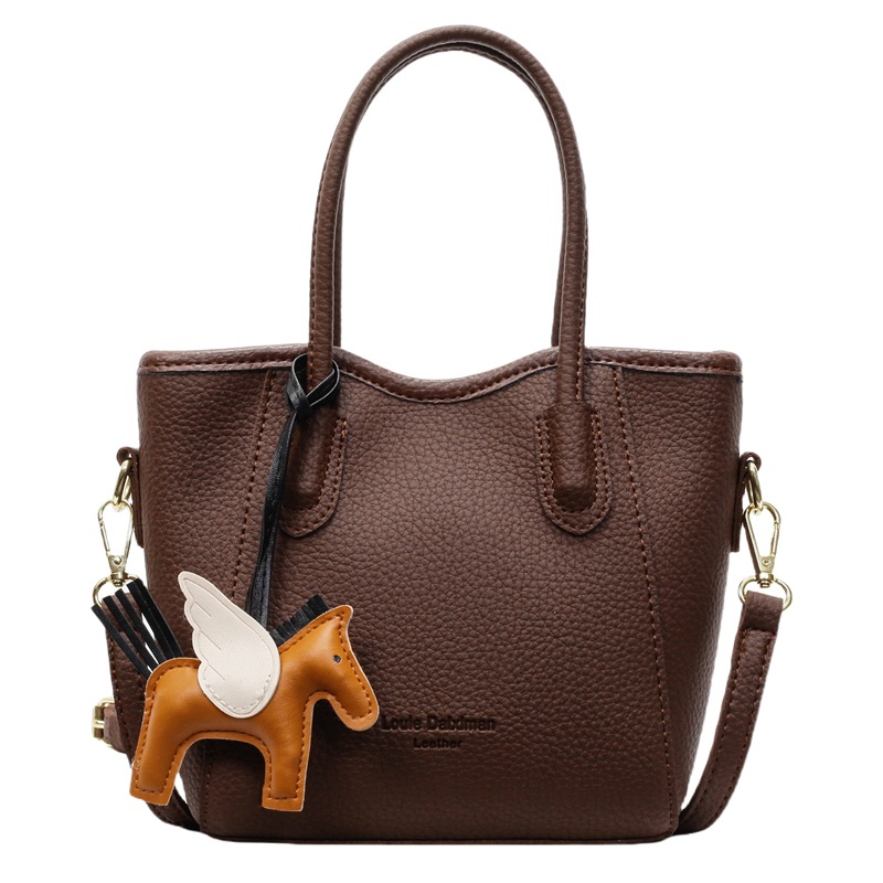 Bolsa de cubo portátil de estilo occidental de alta calidad para mujer 2025 nuevo bolso de mensajero de hombro de viajero de estilo explosivo de moda salvaje