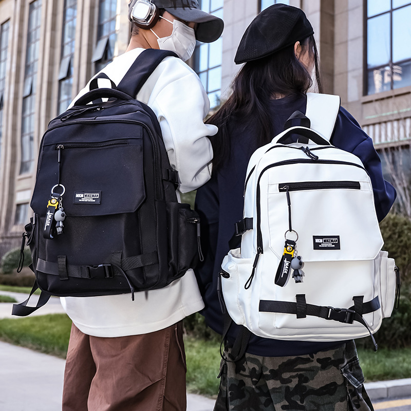 La nueva mochila de la marca de moda para hombres y mujeres de gran capacidad mochila de viaje ligera al aire libre para estudiantes de secundaria y secundaria.